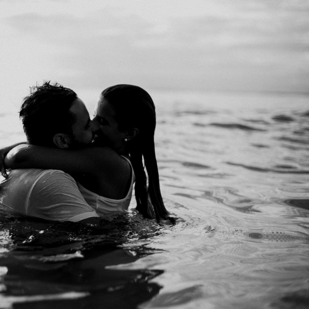 Couple kissing Fascinatedly  In Water