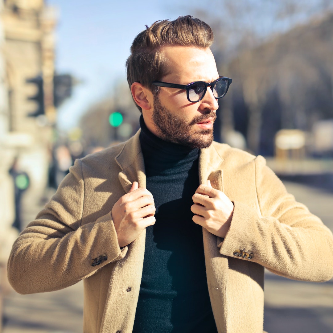 man walking on road